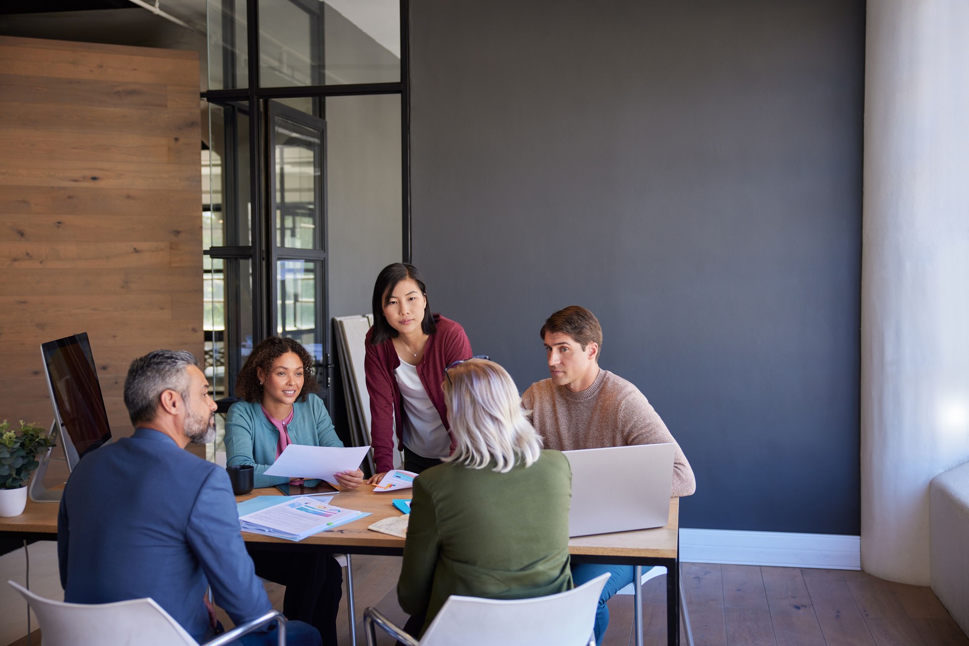 Casual creative business people in meeting with copy space